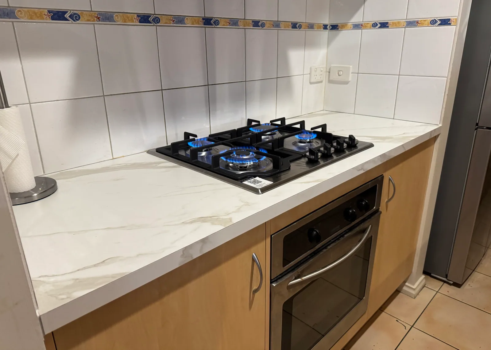 New gas cooktop set into a replacement kitchen benchtop by Quick2Fix